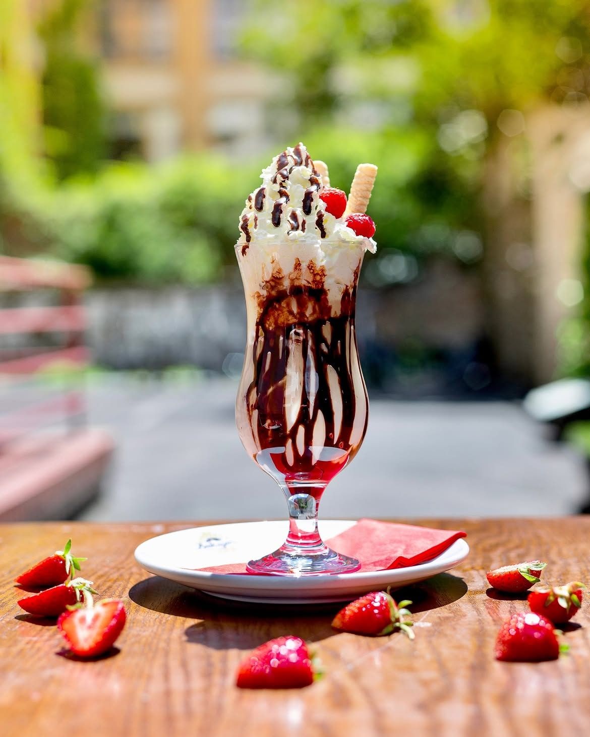 An ice-cream sundae with strawberries